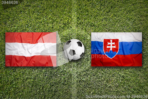 Image of Austria vs. Slovakia flags on soccer field