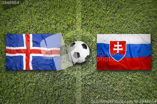Image of Iceland vs. Slovakia flags on soccer field