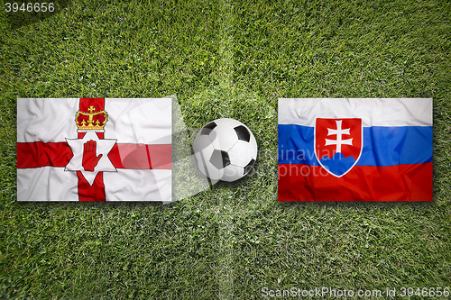 Image of Northern Ireland vs. Slovakia flags on soccer field