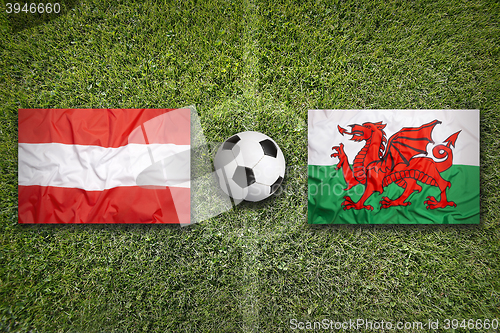 Image of Austria vs. Wales flags on soccer field