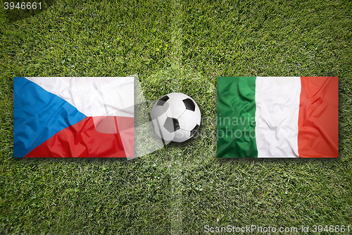 Image of Czech Republic vs. Italy flags on soccer field