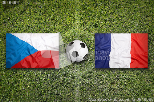 Image of Czech Republic vs. France flags on soccer field