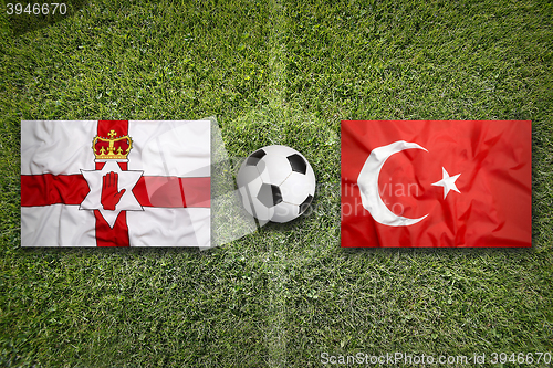 Image of Northern Ireland vs. Turkey flags on soccer field