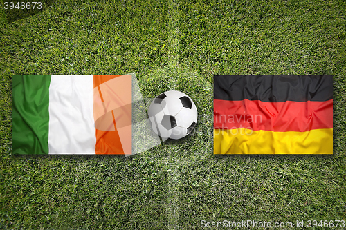 Image of Ireland vs. Germany flags on soccer field