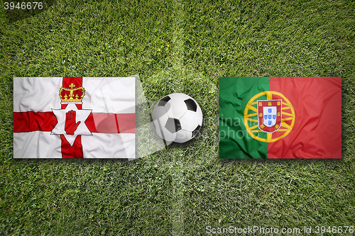 Image of Northern Ireland vs. Portugal flags on soccer field