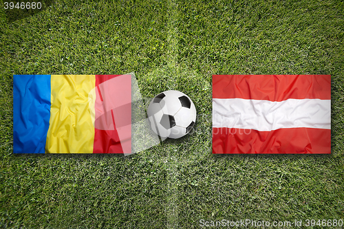 Image of Romania vs. Austria flags on soccer field