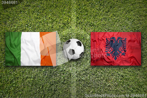Image of Ireland vs. Albania flags on soccer field