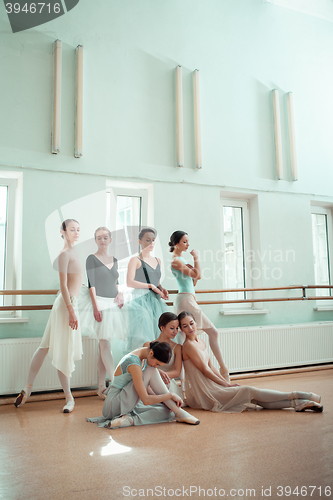 Image of The seven ballerinas at ballet bar