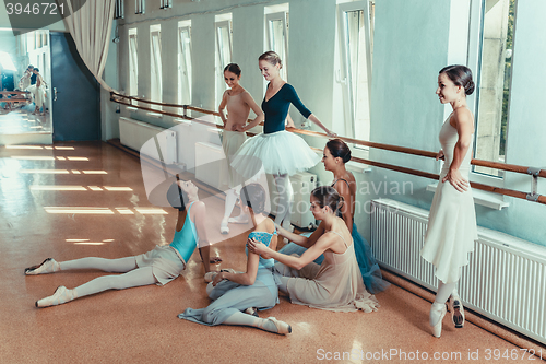 Image of The seven ballerinas at ballet bar