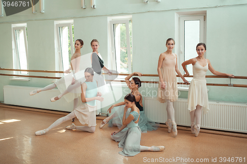 Image of The seven ballerinas at ballet bar