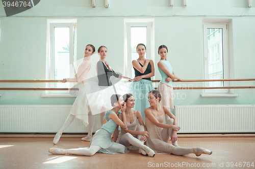 Image of The seven ballerinas at ballet bar