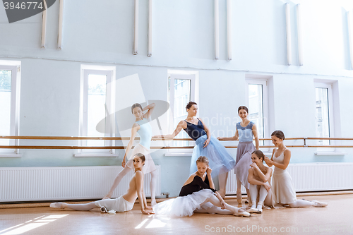 Image of The seven ballerinas at ballet bar