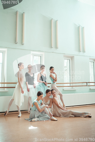 Image of The seven ballerinas at ballet bar