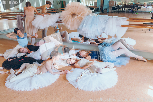 Image of The seven ballerinas against ballet bar