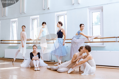 Image of The seven ballerinas at ballet bar