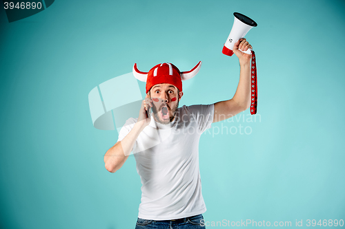 Image of The face of football fan with different emotions on blue