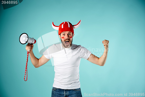 Image of The face of football fan with different emotions on blue