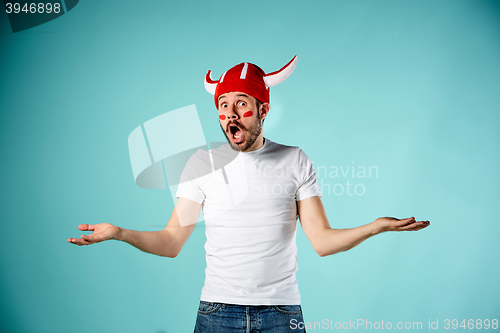 Image of The face of football fan with different emotions on blue