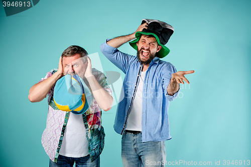 Image of The two football fans over blue