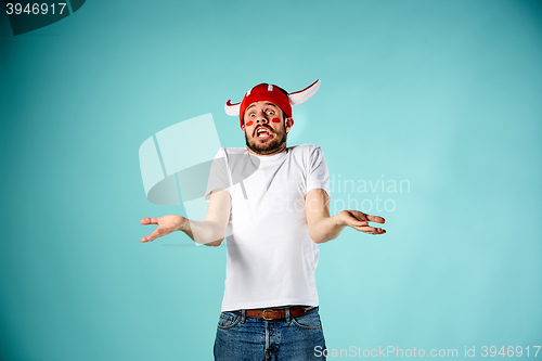 Image of The face of football fan with different emotions on blue