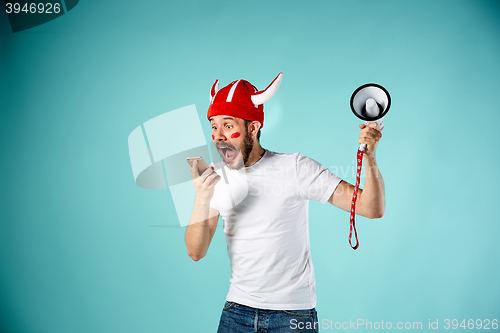 Image of The face of football fan with different emotions on blue