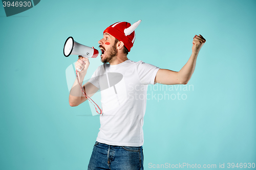 Image of The face of football fan with different emotions on blue