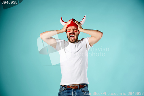 Image of The face of football fan with different emotions on blue