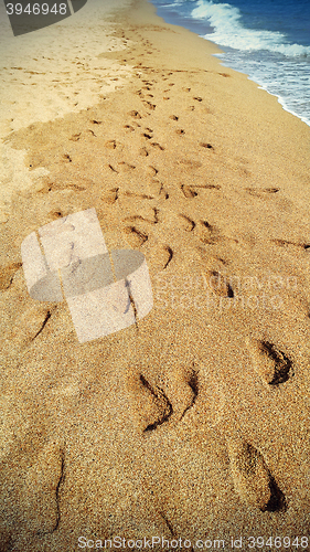 Image of Footsteps on the beach by the sea