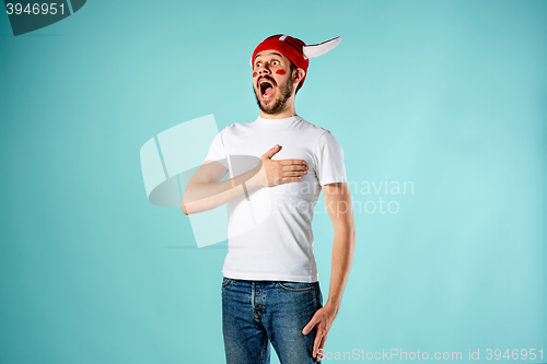 Image of The football fan over blue