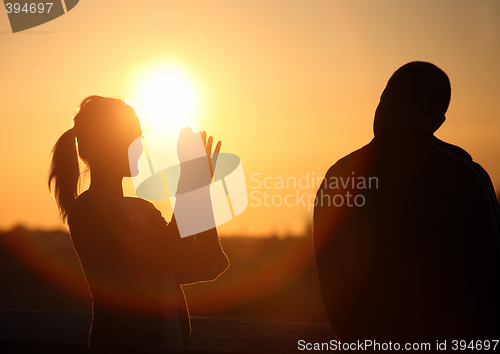 Image of Couple watching sunset