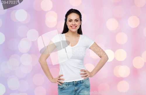 Image of happy young woman or teenage girl in white t-shirt