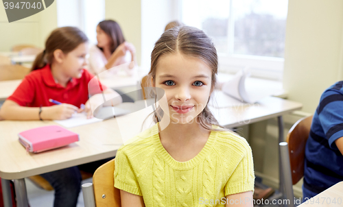 Image of student girl with group of school kids in class