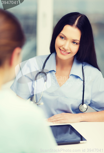 Image of female doctor or nurse with tablet pc computer