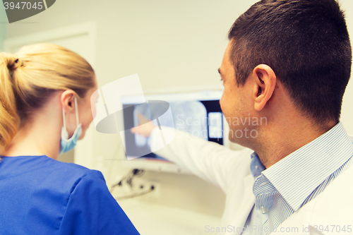 Image of close up of dentist and assistant at dental clinic