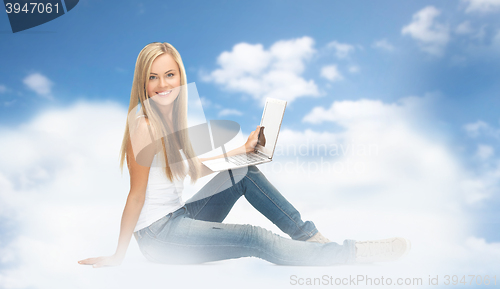 Image of young woman sitting with laptop