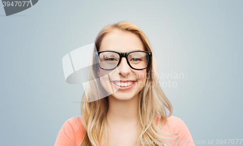 Image of happy young woman or teenage girl in eyeglasses