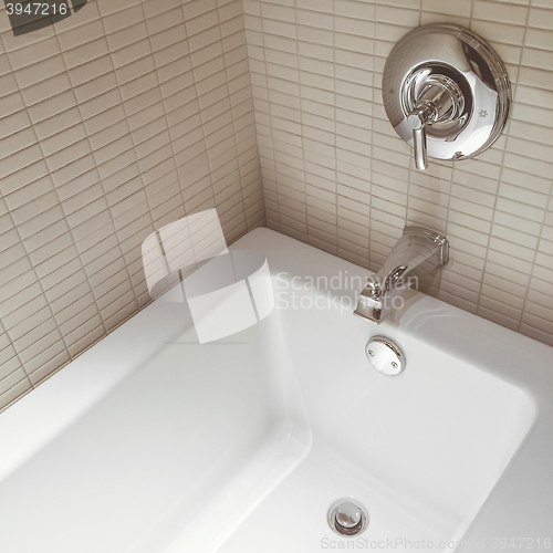 Image of New modern bathroom with chrome faucets