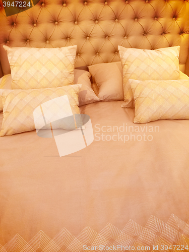 Image of Luxurious bed with silky linen