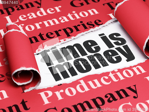 Image of Business concept: black text Time is Money under the piece of  torn paper