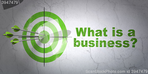 Image of Business concept: target and What is a Business? on wall background