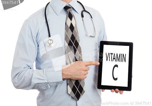 Image of Doctor holding tablet - Vitamin C
