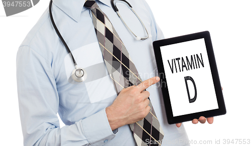 Image of Doctor holding tablet - Vitamin D
