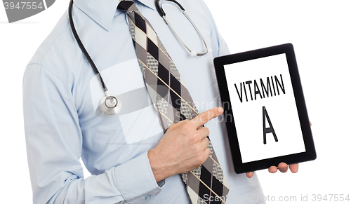 Image of Doctor holding tablet - Vitamin A