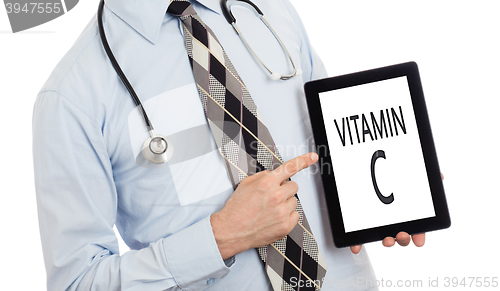 Image of Doctor holding tablet - Vitamin C