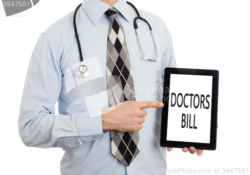 Image of Doctor holding tablet - Doctors bill