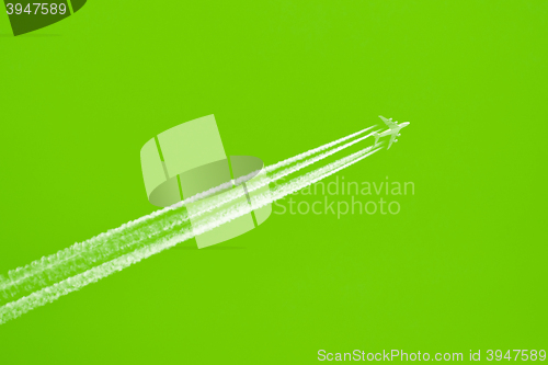Image of Plane in blue sky - Bright green sky