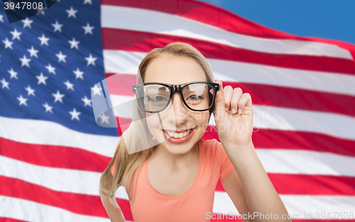 Image of happy young woman or teenage girl in eyeglasses