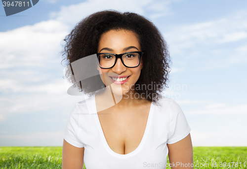 Image of happy african woman or student girl in eyeglasses