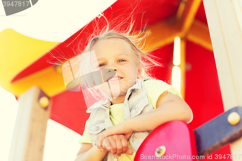 Image of happy little girl on children playground