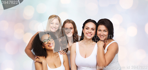 Image of group of happy different women in white underwear